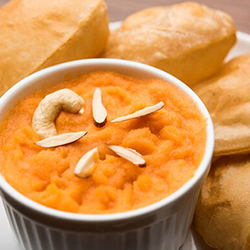 Today's Special Halwa Puri served with semolina sweet and chickpea curry